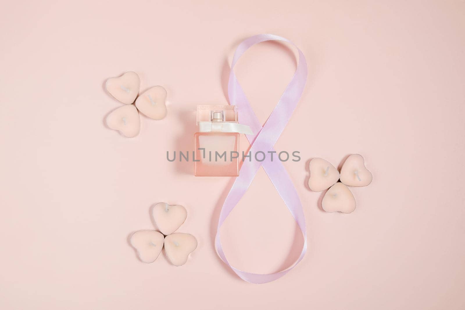 March 8, composition of hearts on a pink background. View from above. Space for text, flat lay