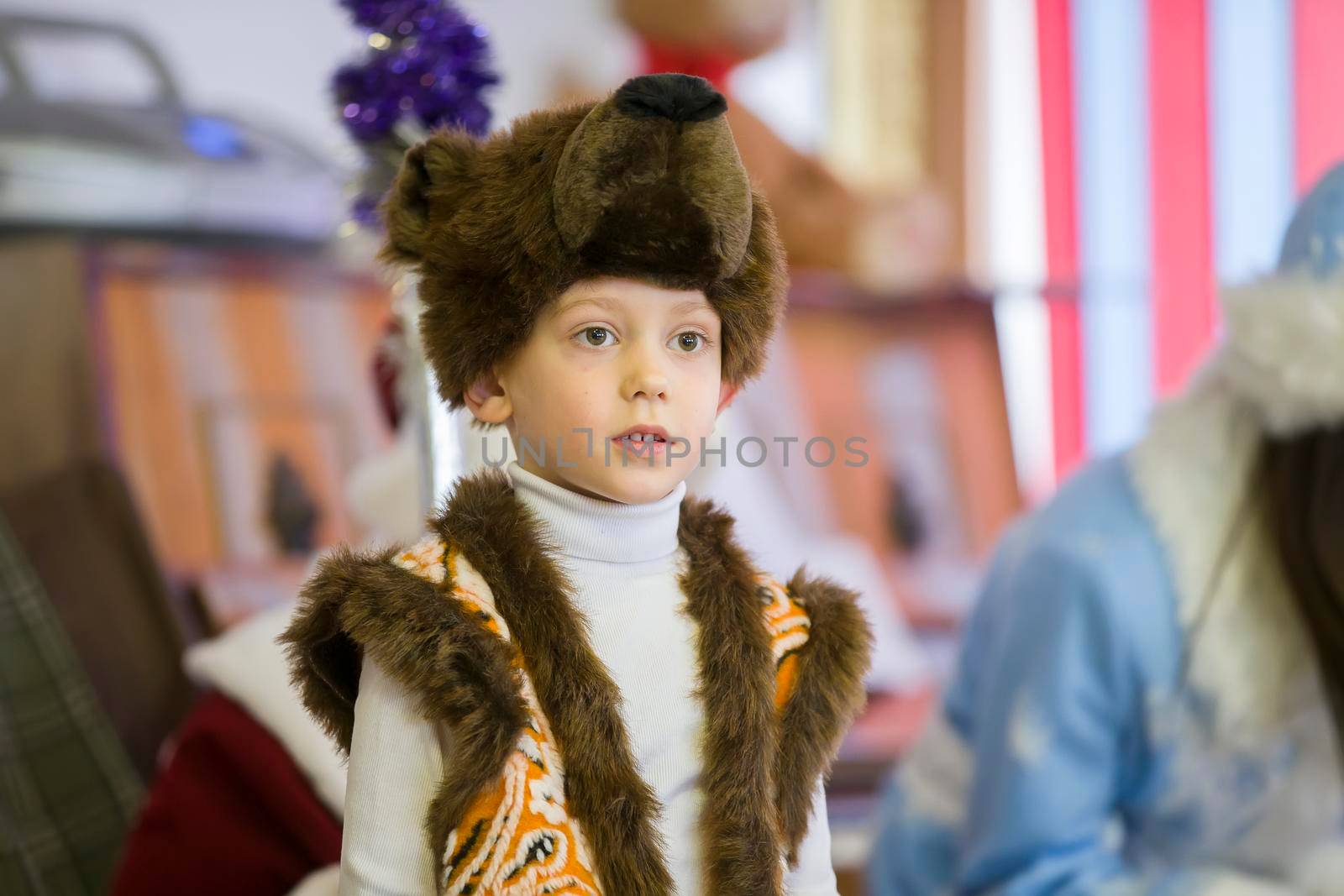 Belarus, the city of Gomil, December 27, 2018. Morning party in kindergarten.Child in a fancy dress. Boy in a mask of a bear.