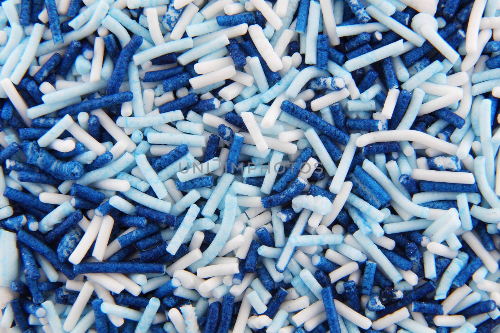 White and blue hundreds and thousands sprinkles sugar beads for decorating cakes and desserts