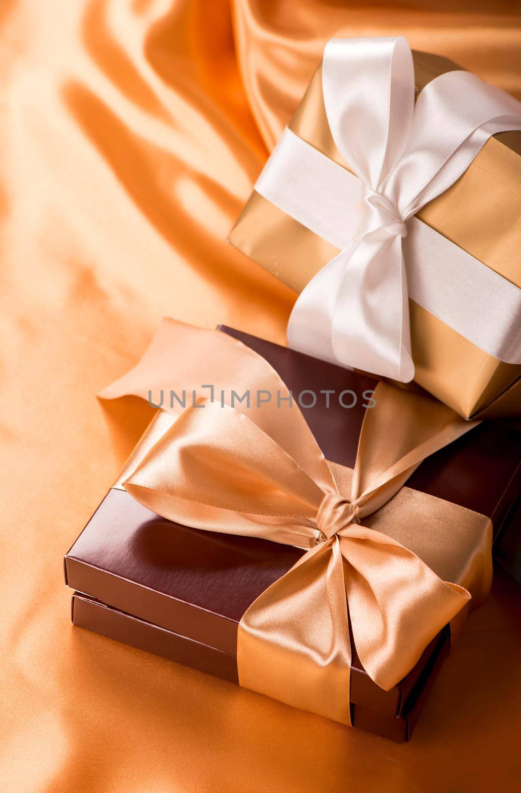 brown box with candies and golden tape close up