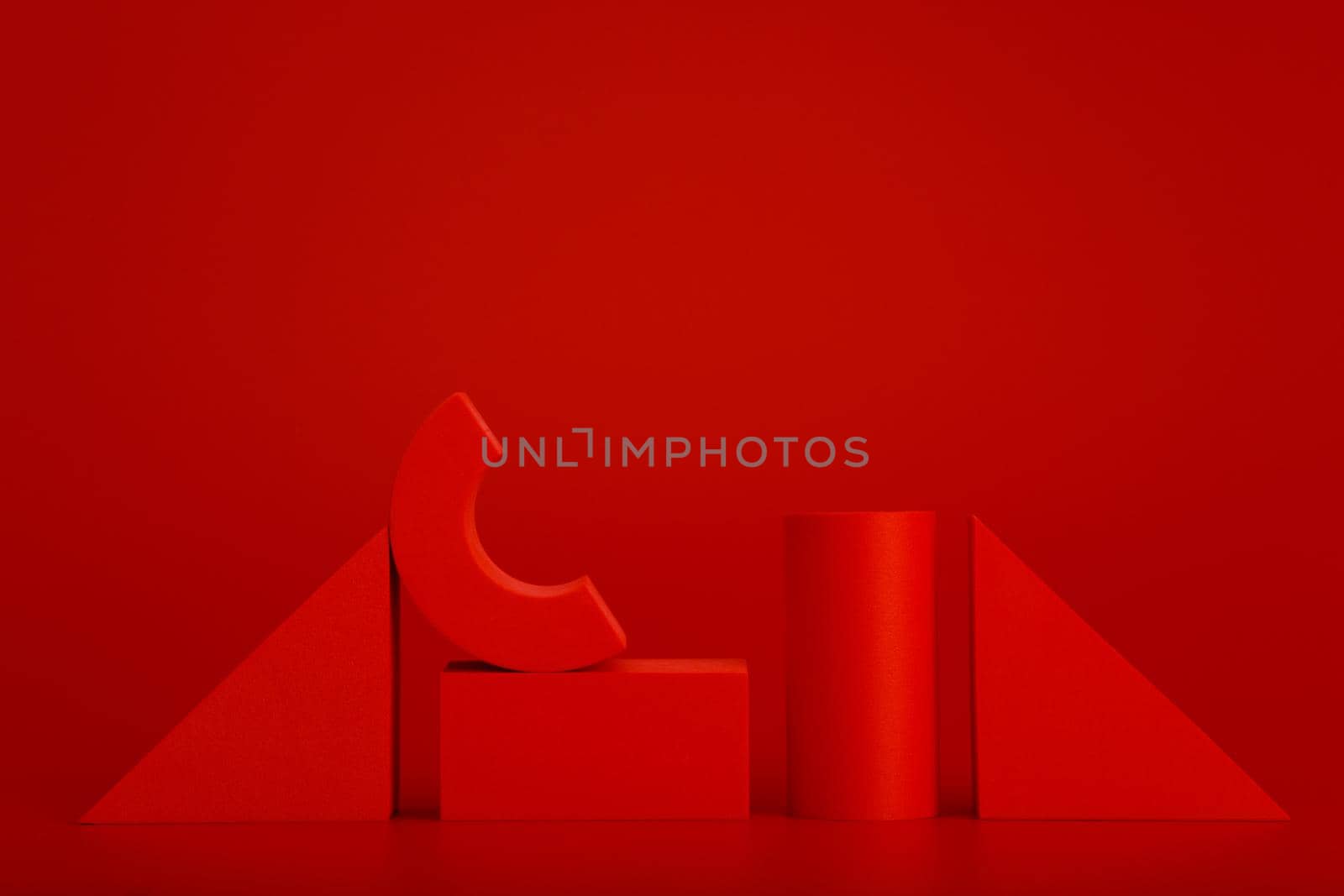 Red abstract horizontal monochromatic background with geometrical figures and space for text. Concept of monochrome and minimalistic template