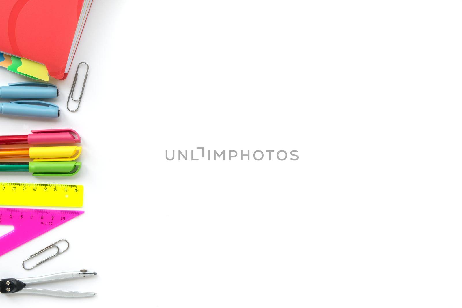 School and Office drawing supplies isolated on white background. Free space for text. Back to school. Top view border of colour pens, rulers and note