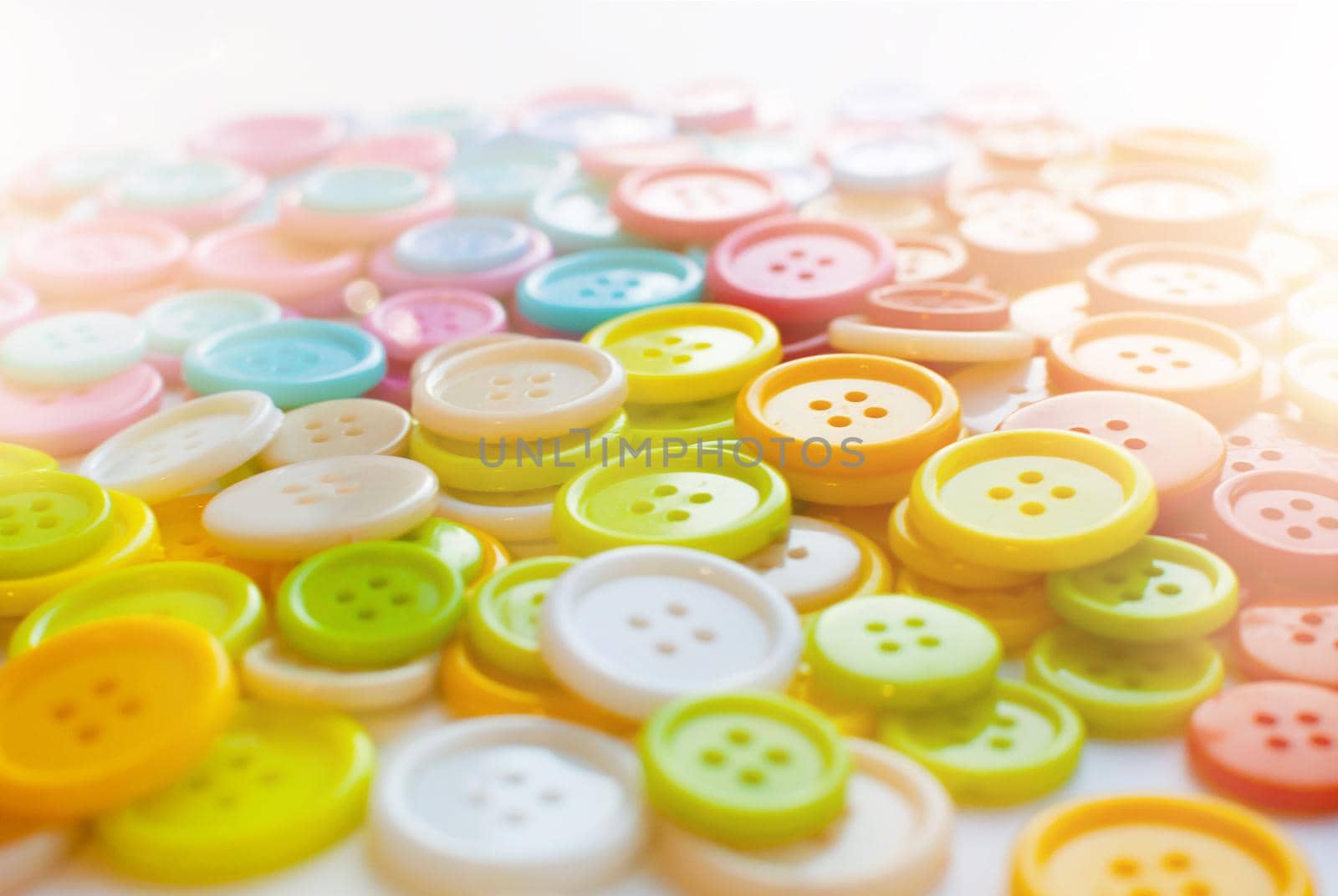 Many Colorful Sewing buttons. Bright background