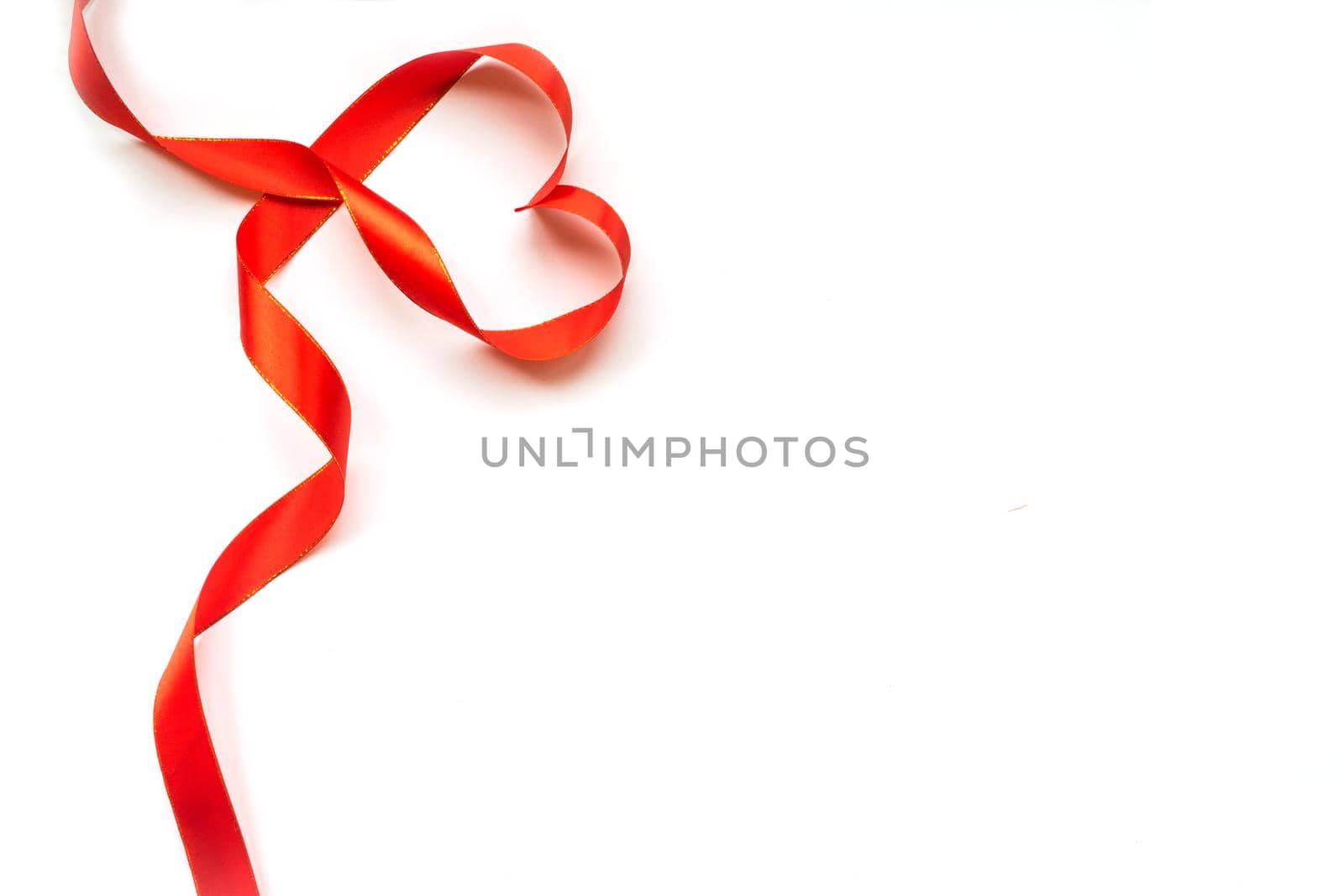 Top view of ribbon shaped as heart isolated on white background. Valentine's day concept. Copyspace