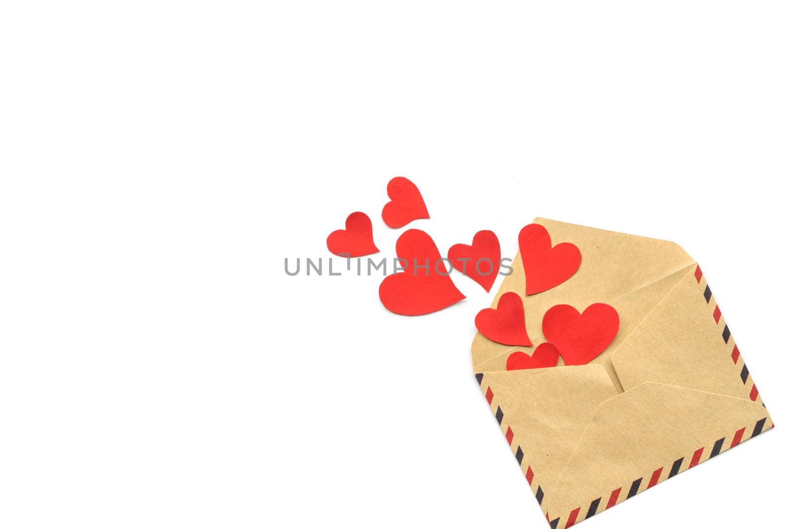 Valentine day, red hearts from the craft envelope isolated on white background. Love concept. 14 february. Copyspace