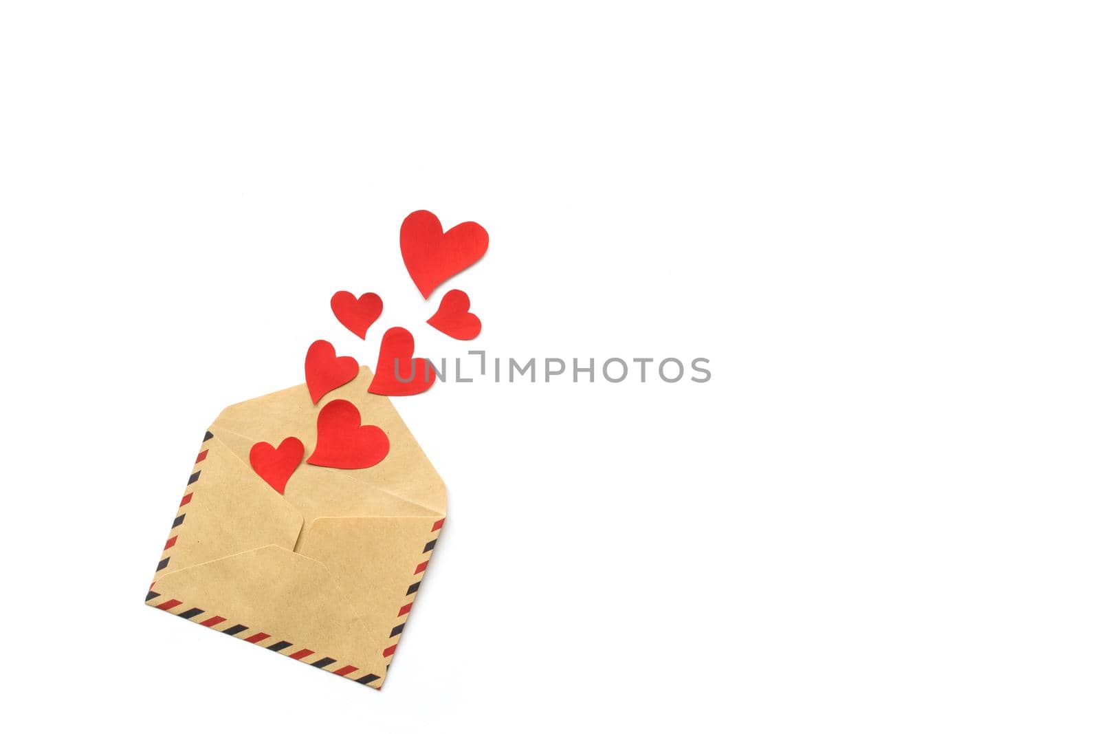 Valentines day, red hearts from the craft envelope isolated on white background. Love concept. Copyspace