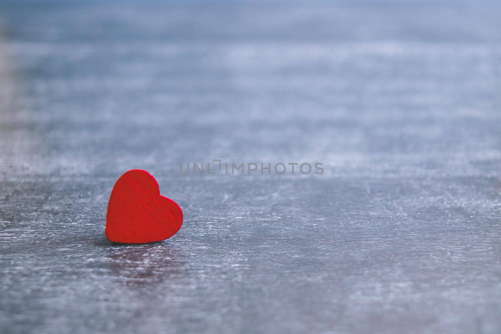 Valentines day card with red heart on dark wooden background, love message. Love concept. Romantic. Copyspace