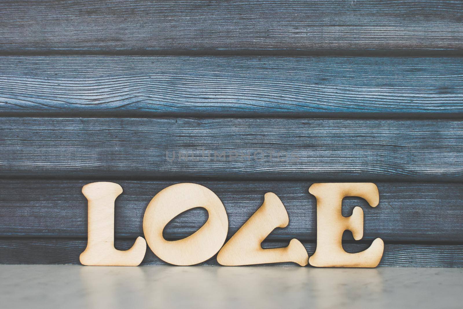 Valentines Day card background. Decorative wooden word on dark background. Valentine Day romantic. Love concept. Copyspace