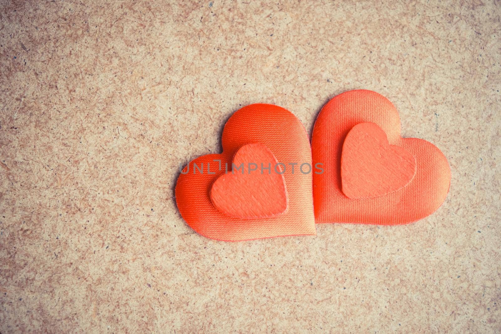 Two Red hearts on the wooden desk background. Copyspace