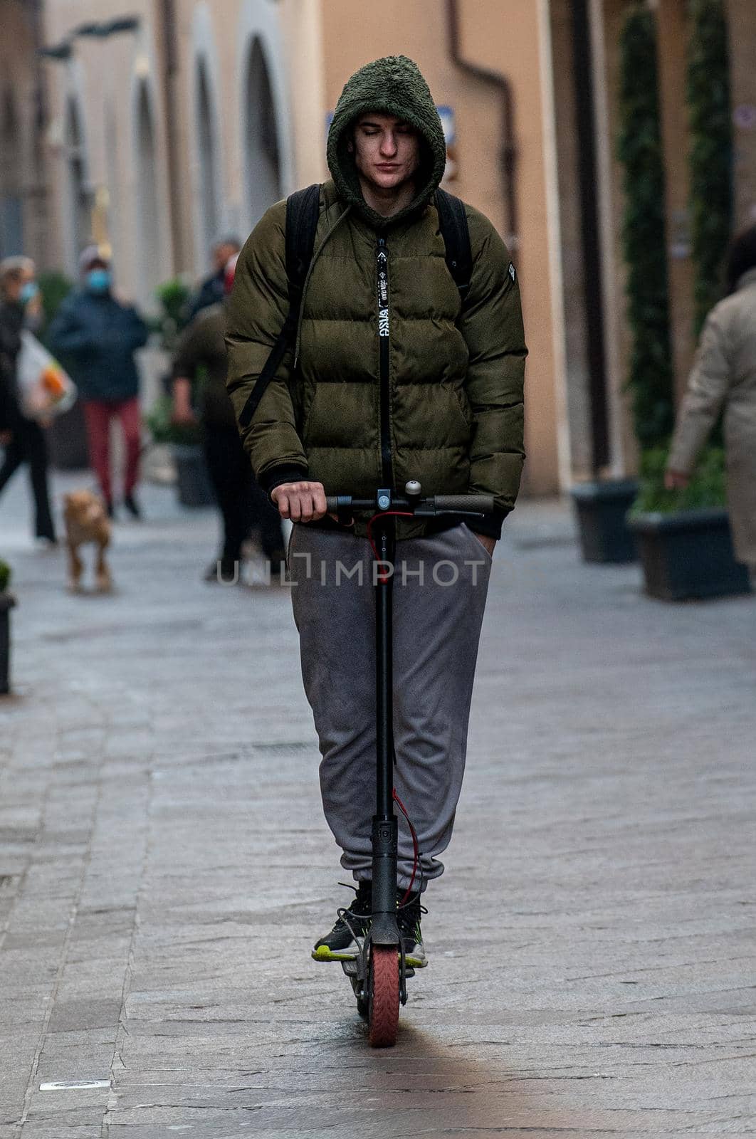 terni,italy february 05 2021:boy who goes with the scooter or in the city