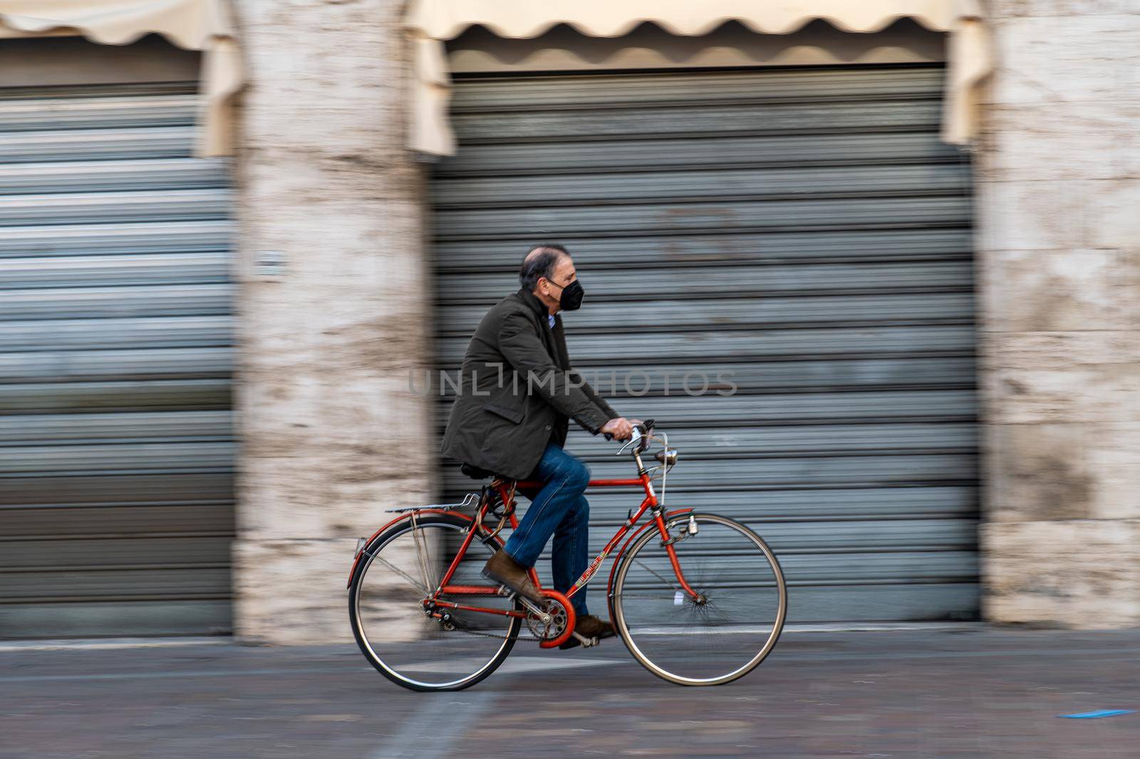 terni,italy february 05 2021:man on a bicycle in the central square of terni