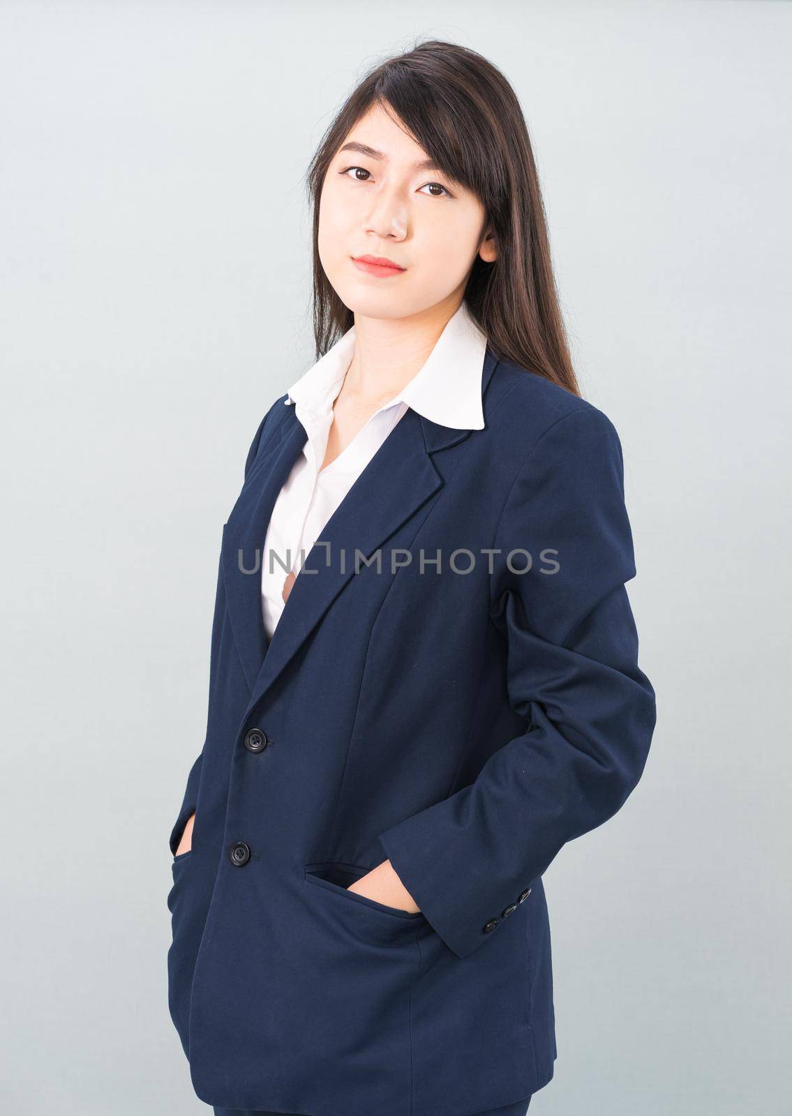 Portrait of asian businesswoman isolated on gray by stoonn