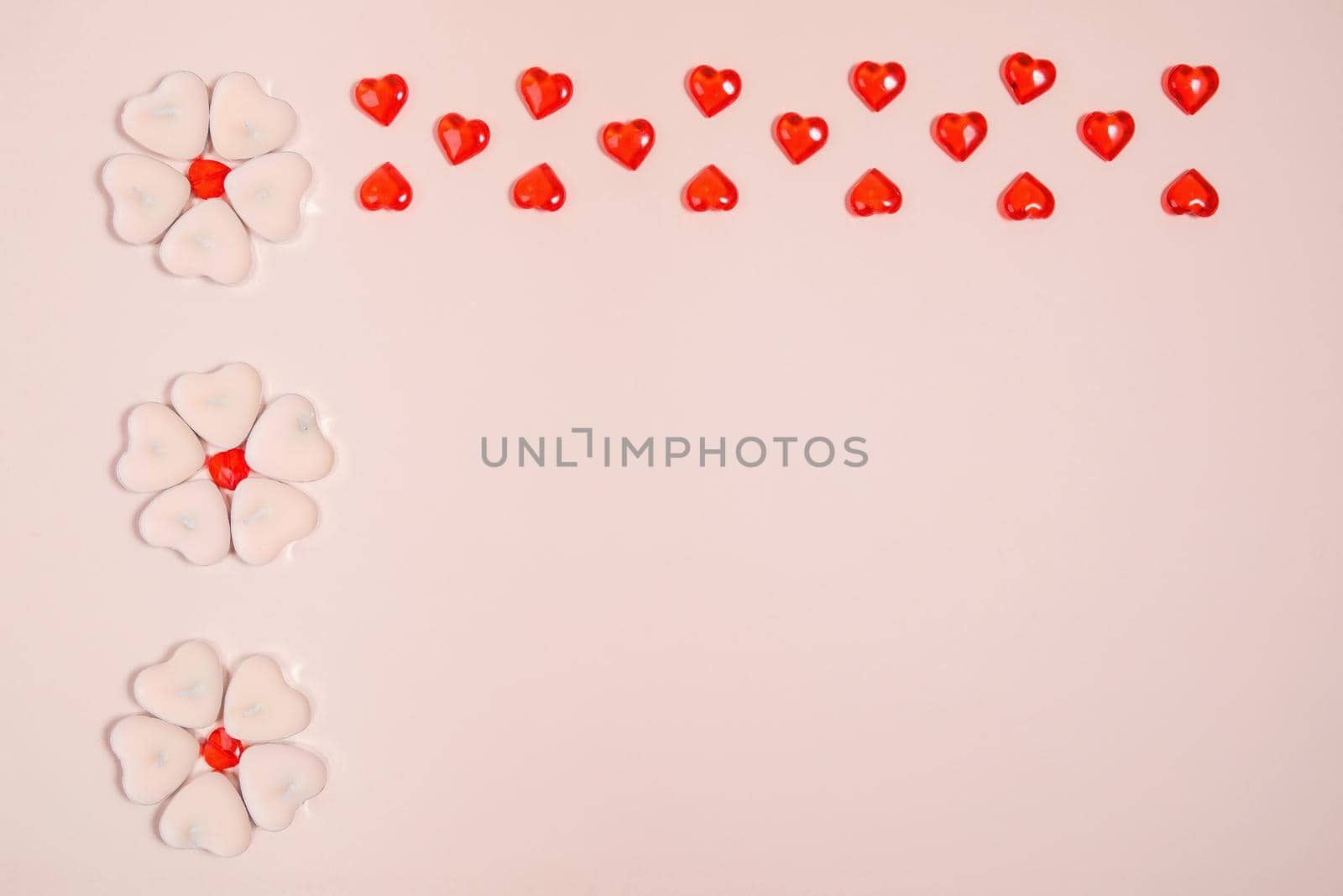 Valentine's Day, composition of hearts on a pink background. View from above. Space for text, flat lay