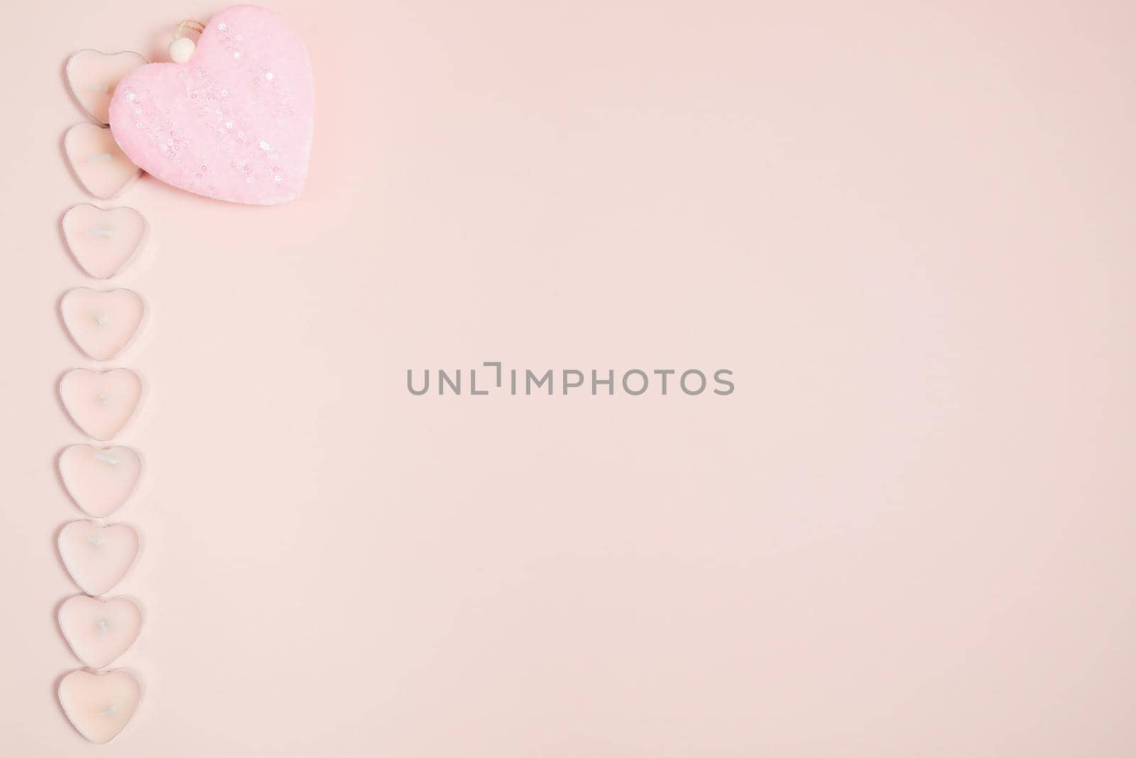 Valentine's Day, composition of hearts on a pink background. View from above. Space for text, flat lay