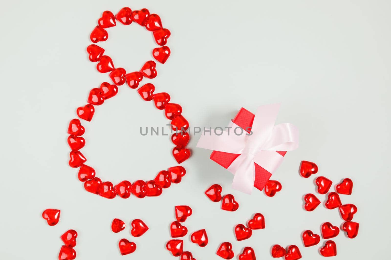 March 8, composition of hearts on a blue background. View from above. Space for text, flat lay