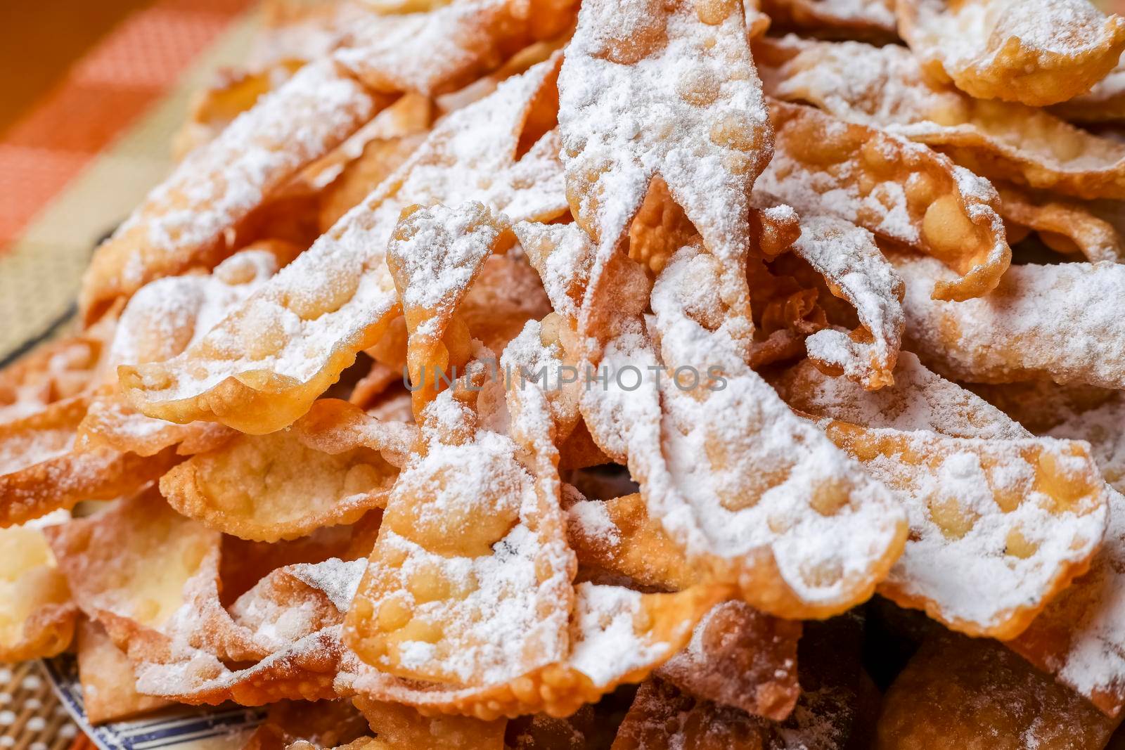 Crunchy pastry, cookies, twigs or crunches in powdered sugar.