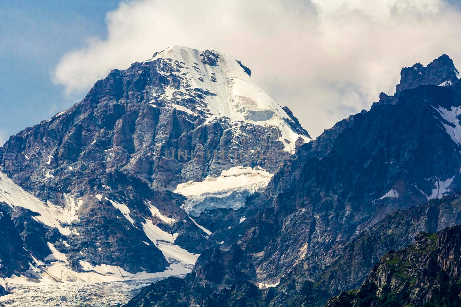 The Caucasus mountains, a glacier on top of the rocks, from the glacier there are three waterfalls. A great fascinating landscape.