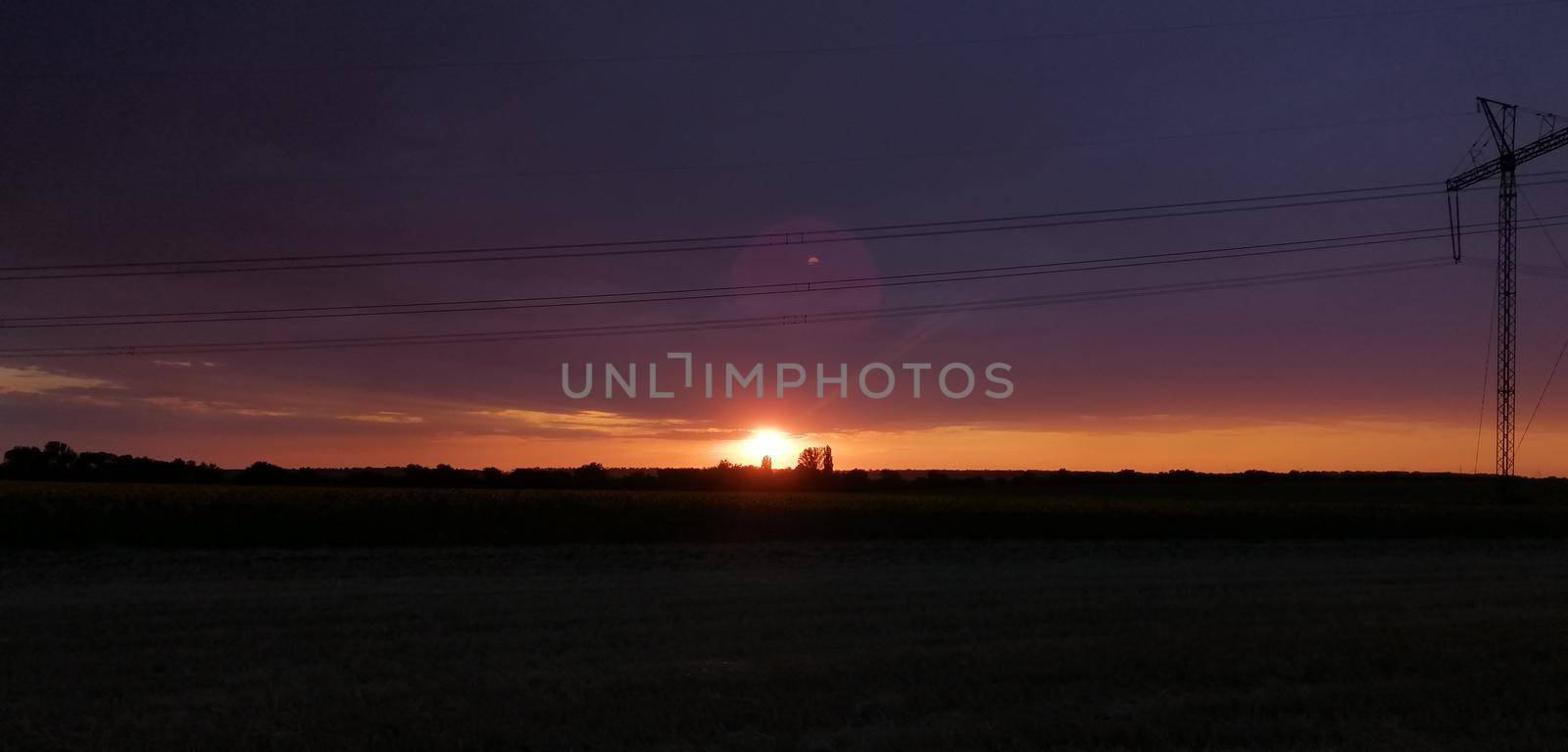 sunset on the background of power lines. High quality photo