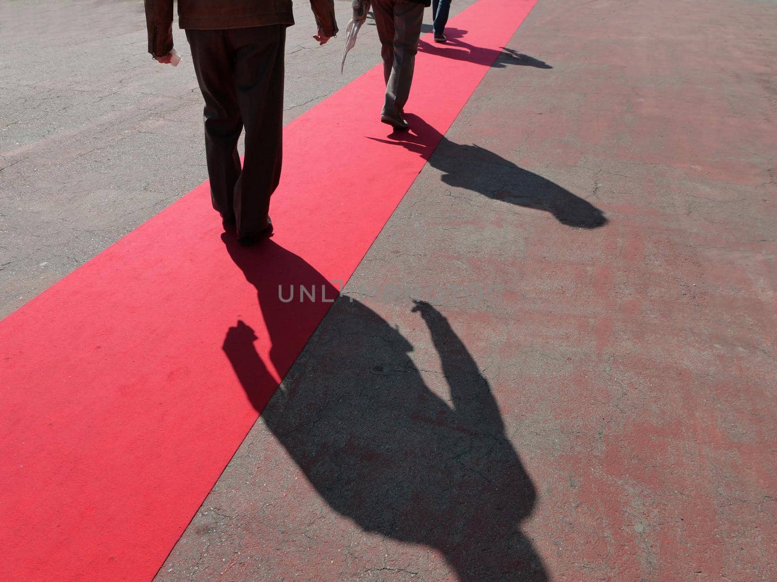 Walking persons  on red carpet close view on legs by lemar