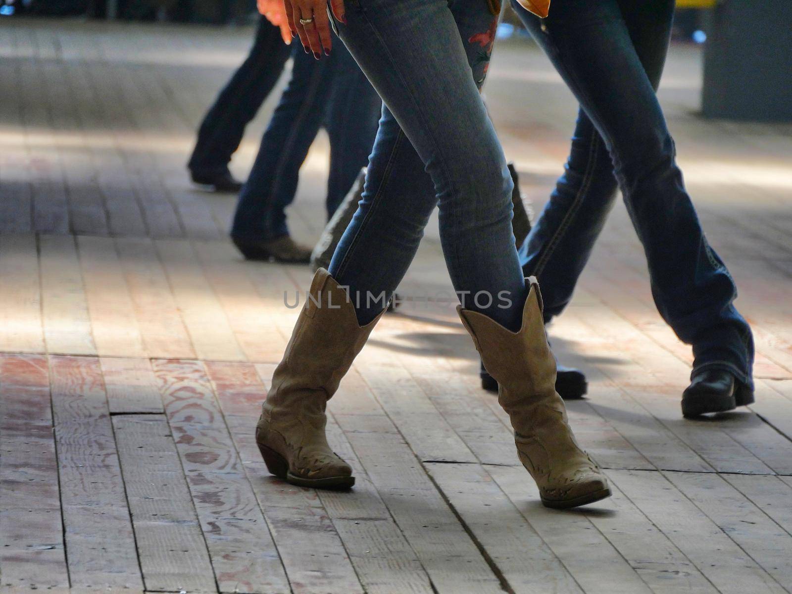 Legs close up of traditional western folk music dancers blur dynamism effect