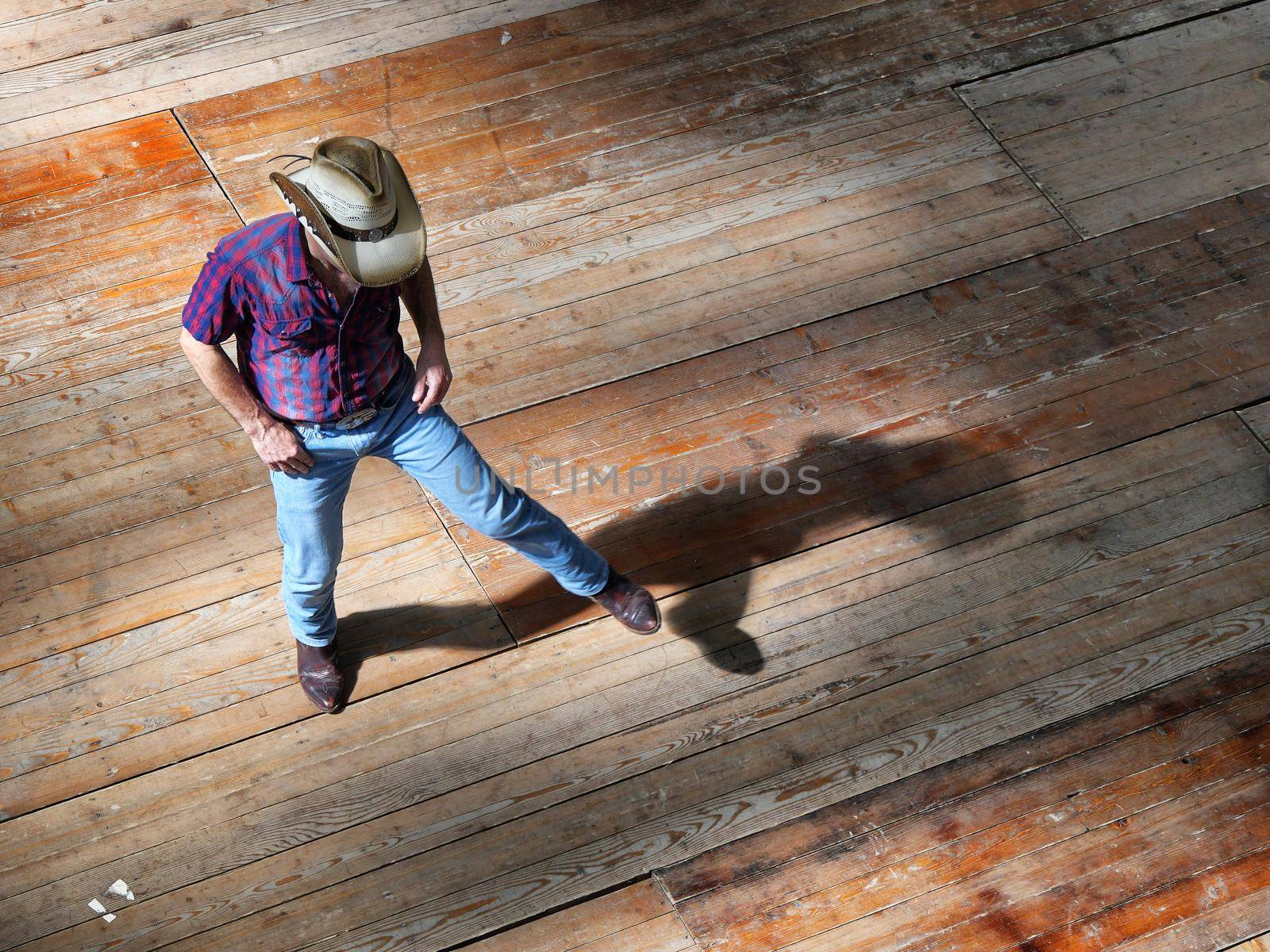 Single man traditional western folk music dancer view from above