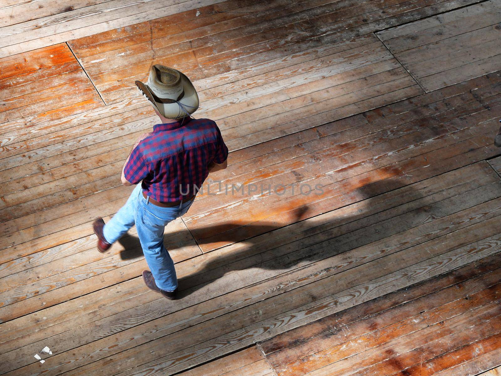 Single man traditional western folk music dancer view from above