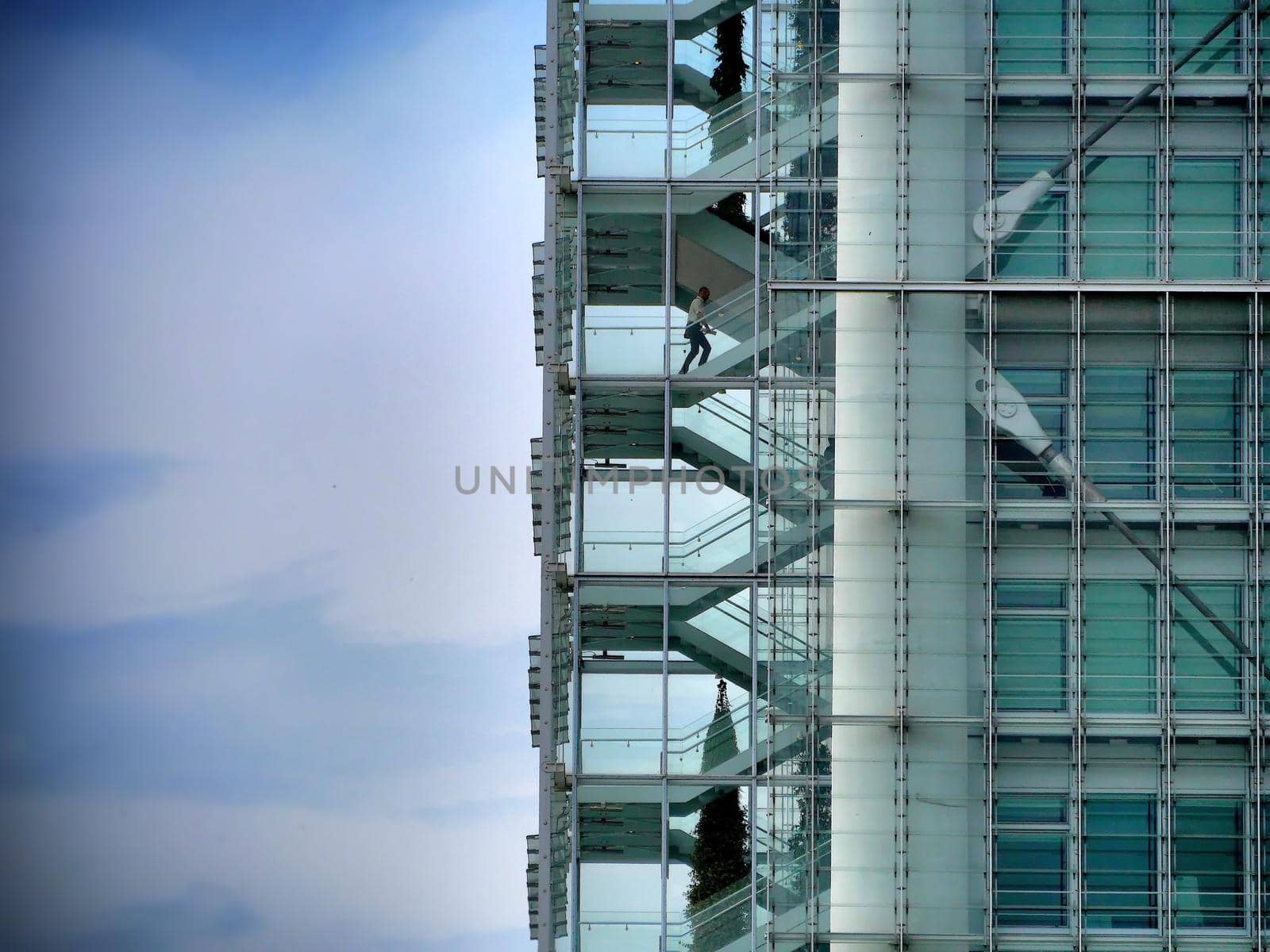 detail of lonely man climbing the skyscraper stairs blank space for text