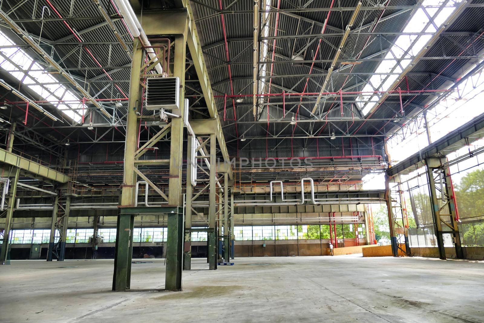 Empty abandoned industrial plant interior view
