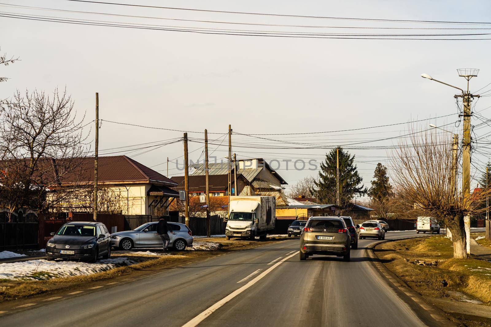 Road view through car windshield, cars on road in traffic in Bucharest, Romania, 2021 by vladispas