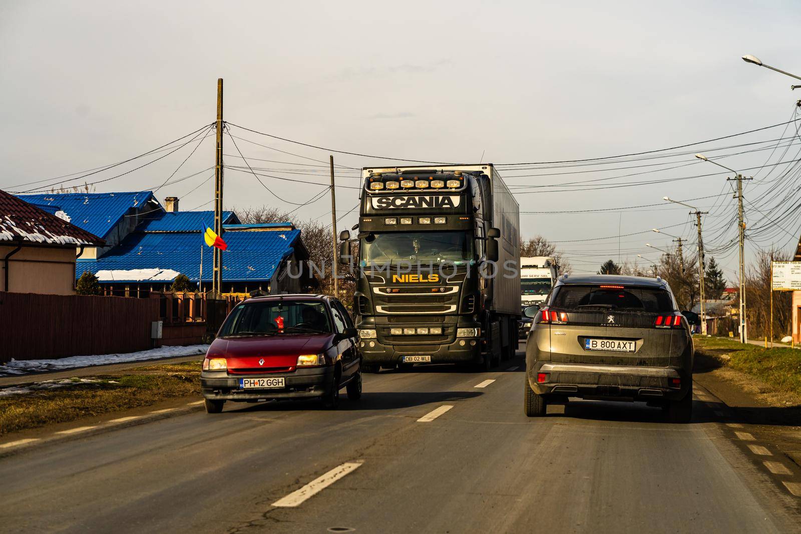 Road view through car windshield, cars on road in traffic in Bucharest, Romania, 2021