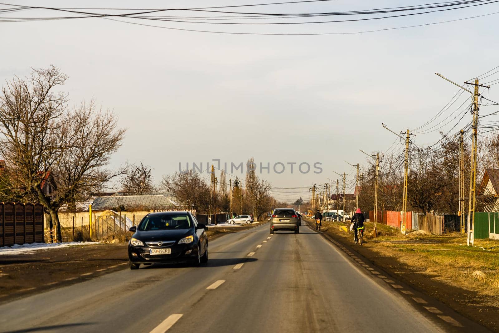 Road view through car windshield, cars on road in traffic in Bucharest, Romania, 2021 by vladispas