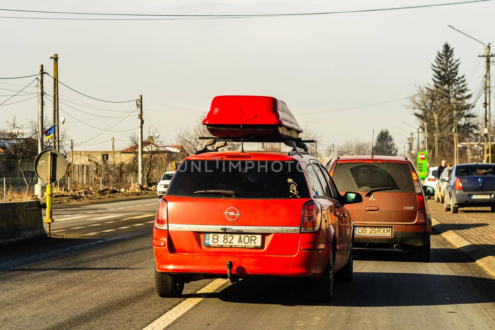 Road view through car windshield, cars on road in traffic in Bucharest, Romania, 2021 by vladispas