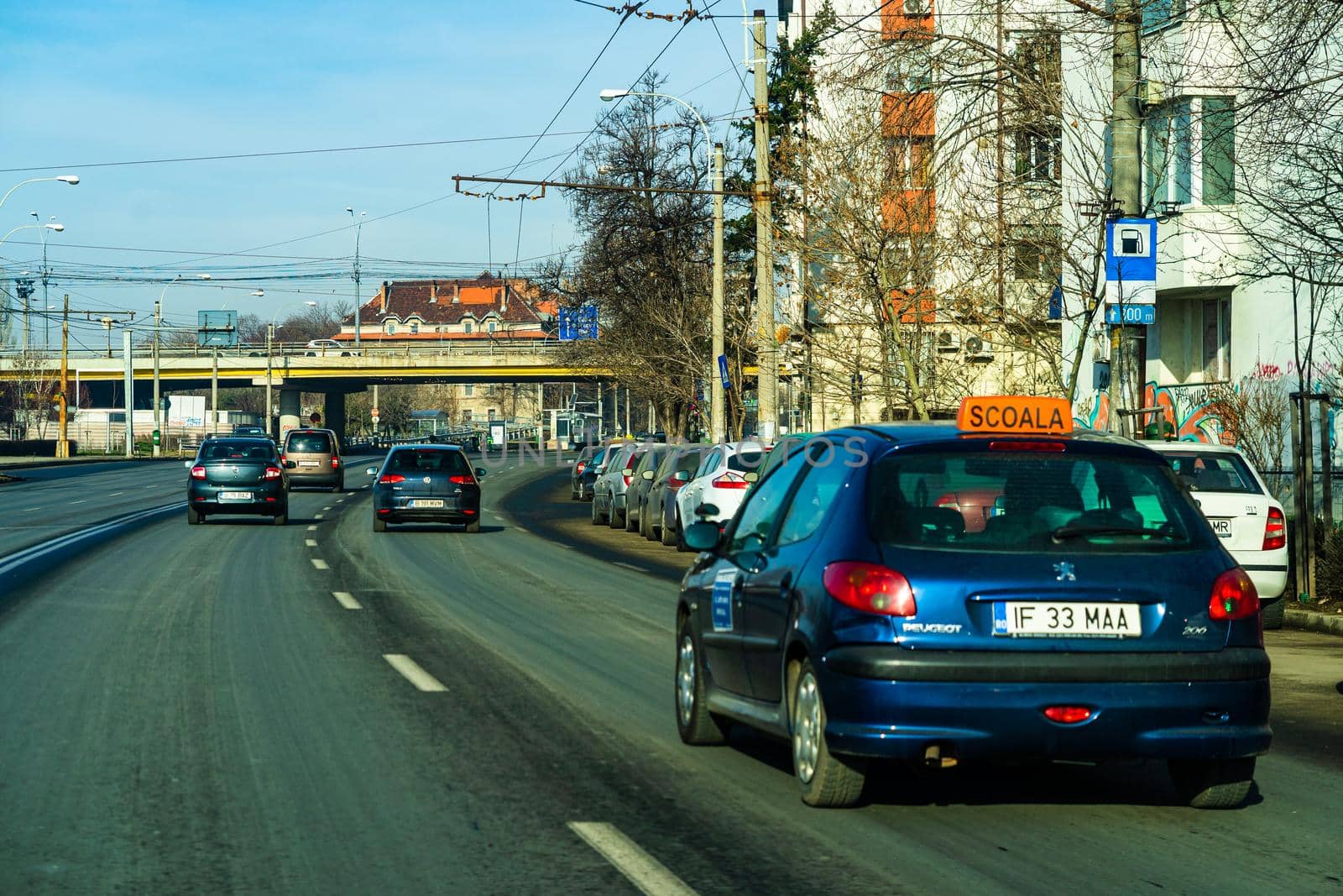 Road view through car windshield, cars on road in traffic in Bucharest, Romania, 2021 by vladispas