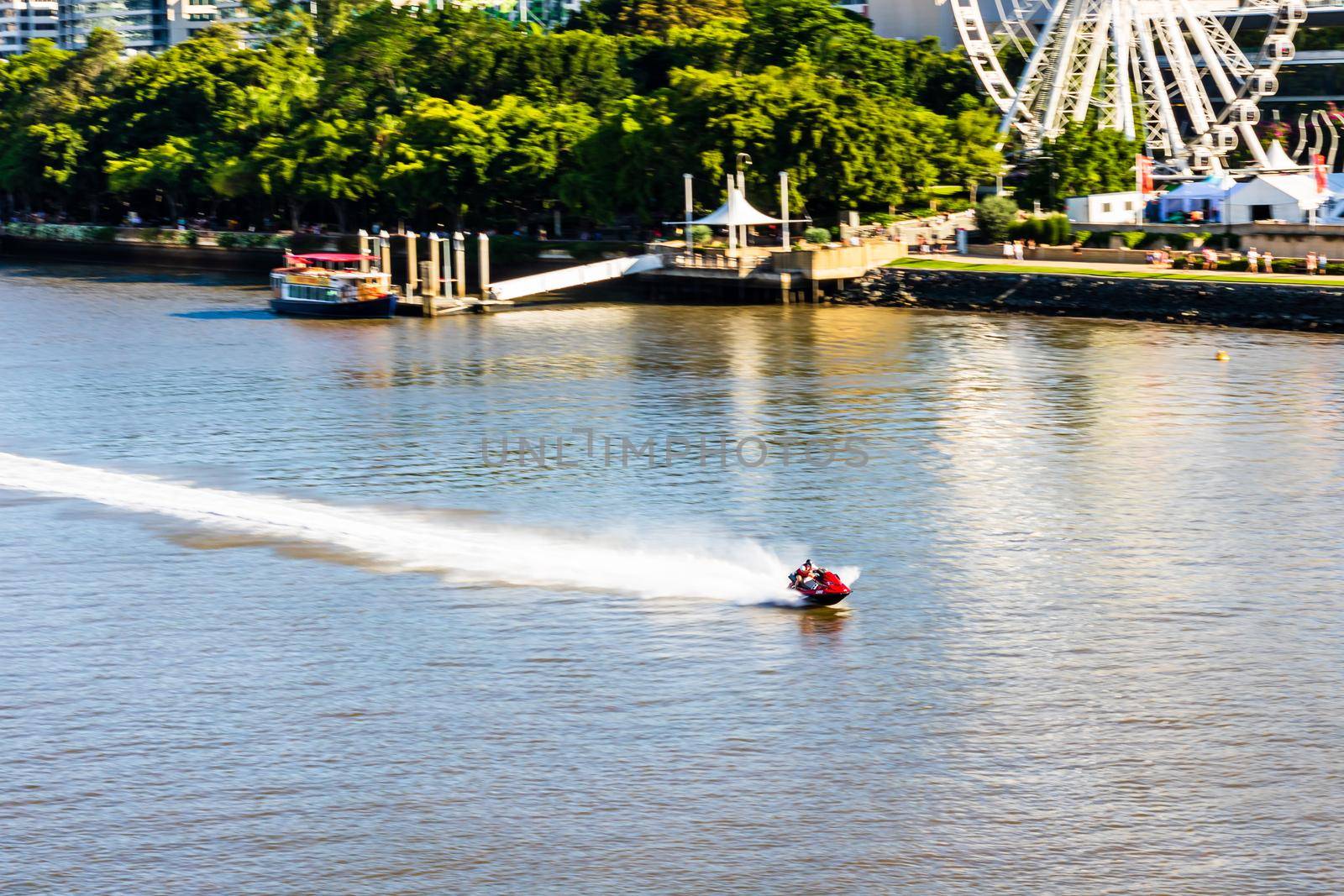 Man on ski jet in Brisbane river, Australia, 2021 by vladispas