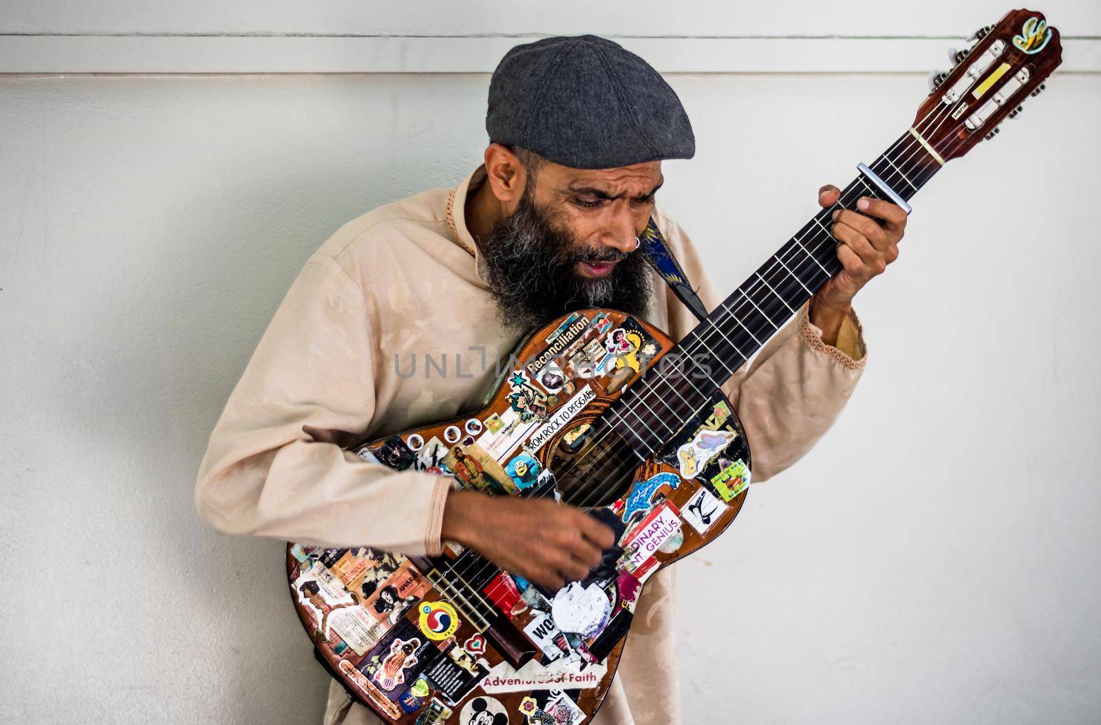 Local guitar singer performing on the streets of downtown Brisbane, Australia, 2021 by vladispas