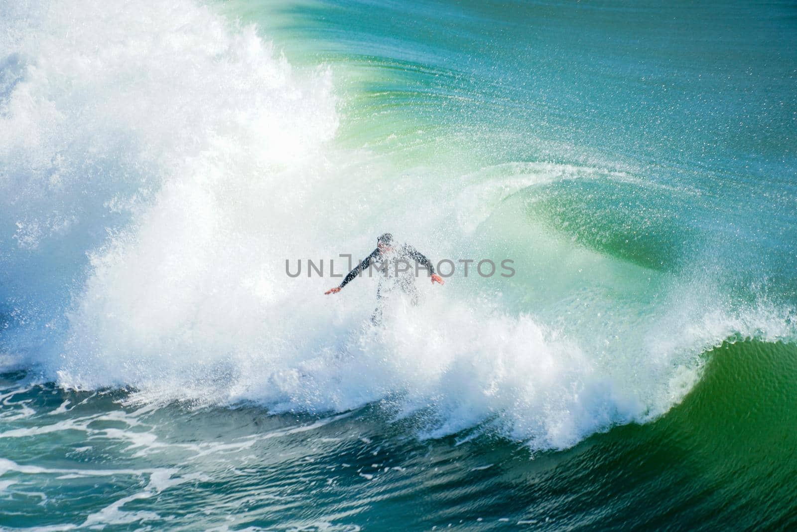 Male surfers enjoying the big wave in Oceanside in North San Diego, California, USA. Travel destination in the South West Coast famous for surfer. January 2n, 2021