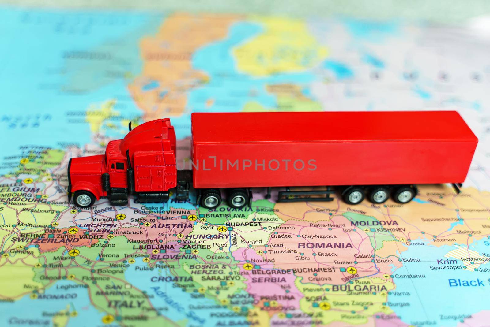 Truck with trailer on the Europe map. by dmitrimaruta