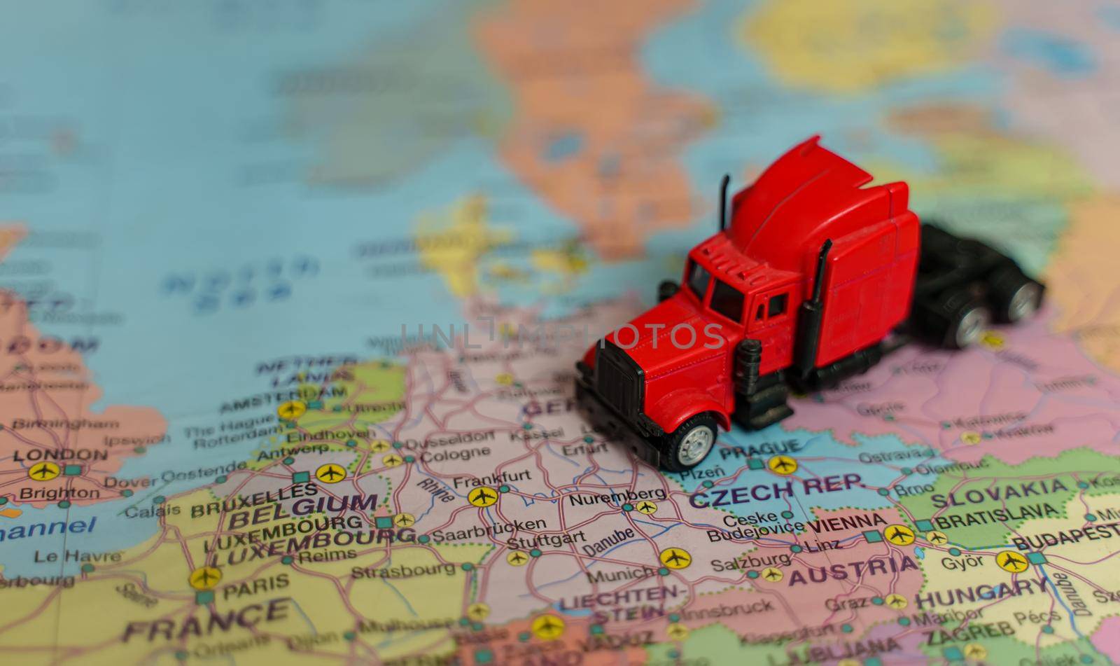 Red truck on the Europe map. by dmitrimaruta