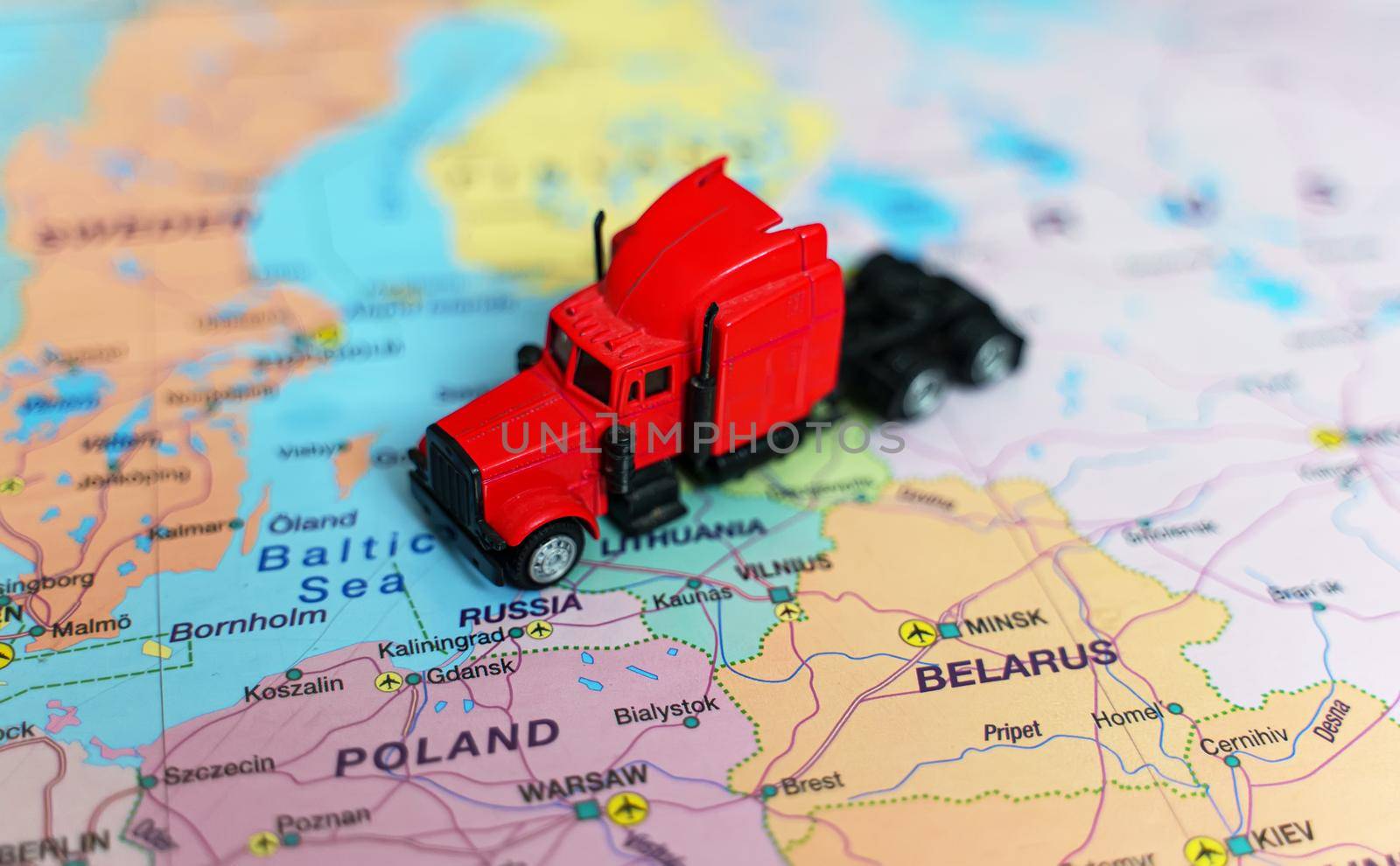 Red truck on the Europe map. by dmitrimaruta