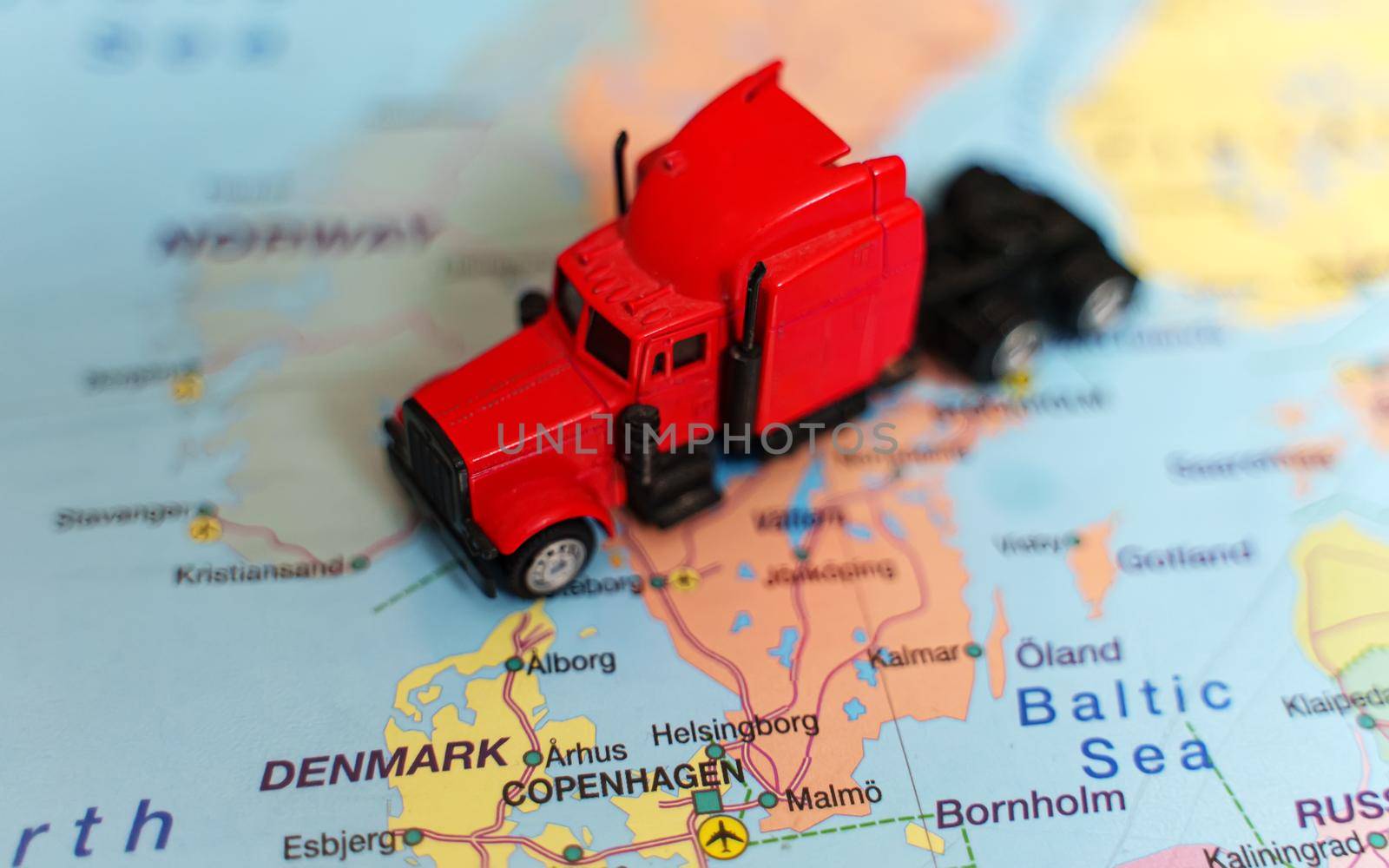 Red truck on the Europe map. by dmitrimaruta