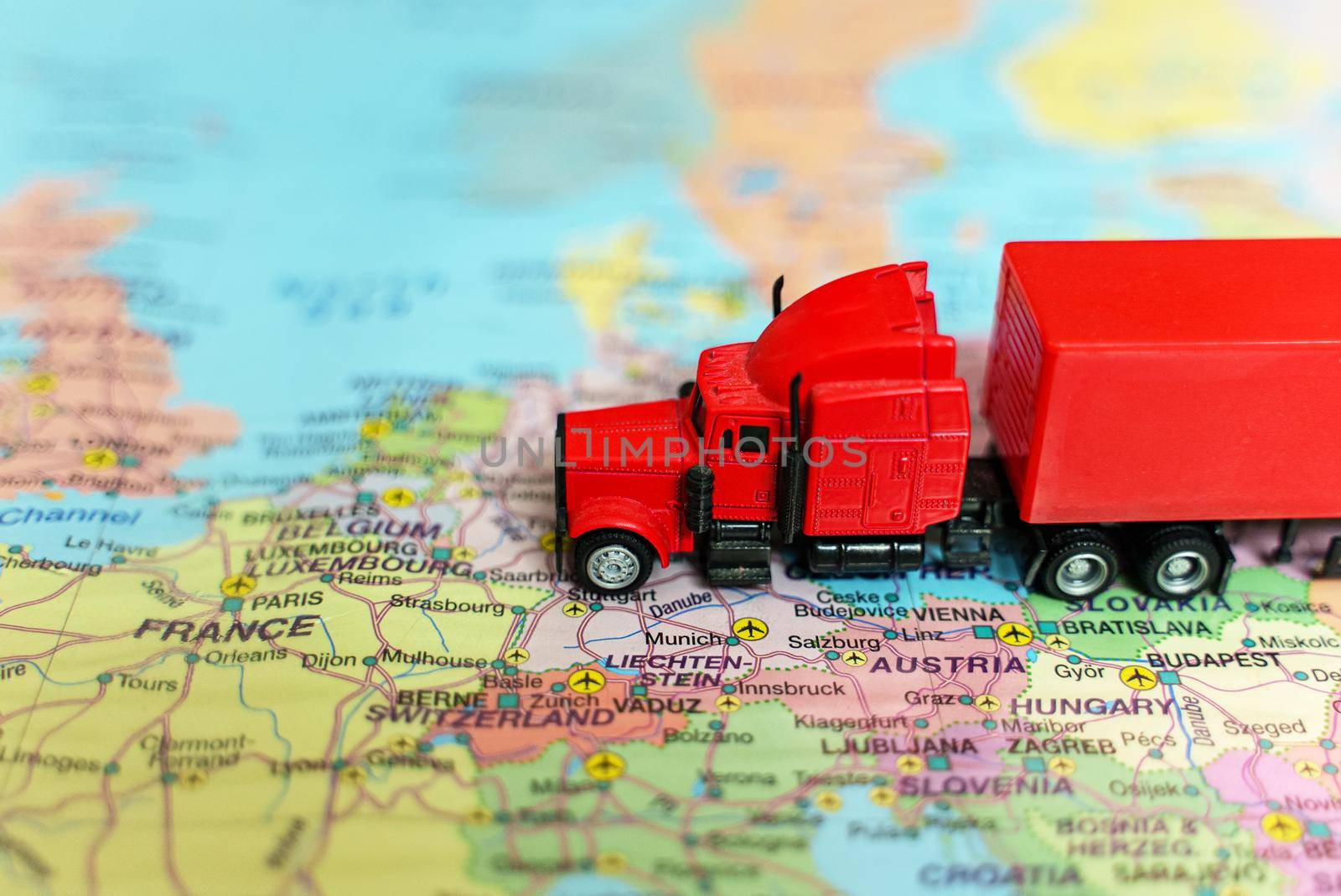 Truck with trailer on the Europe map. by dmitrimaruta