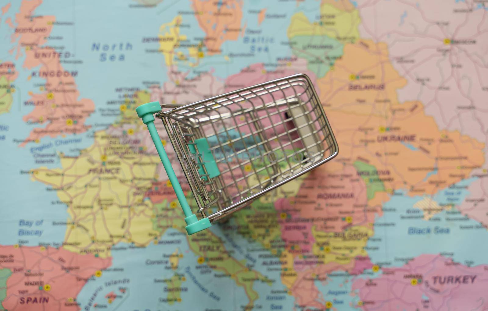 Empty shopping cart on the Europe map. by dmitrimaruta