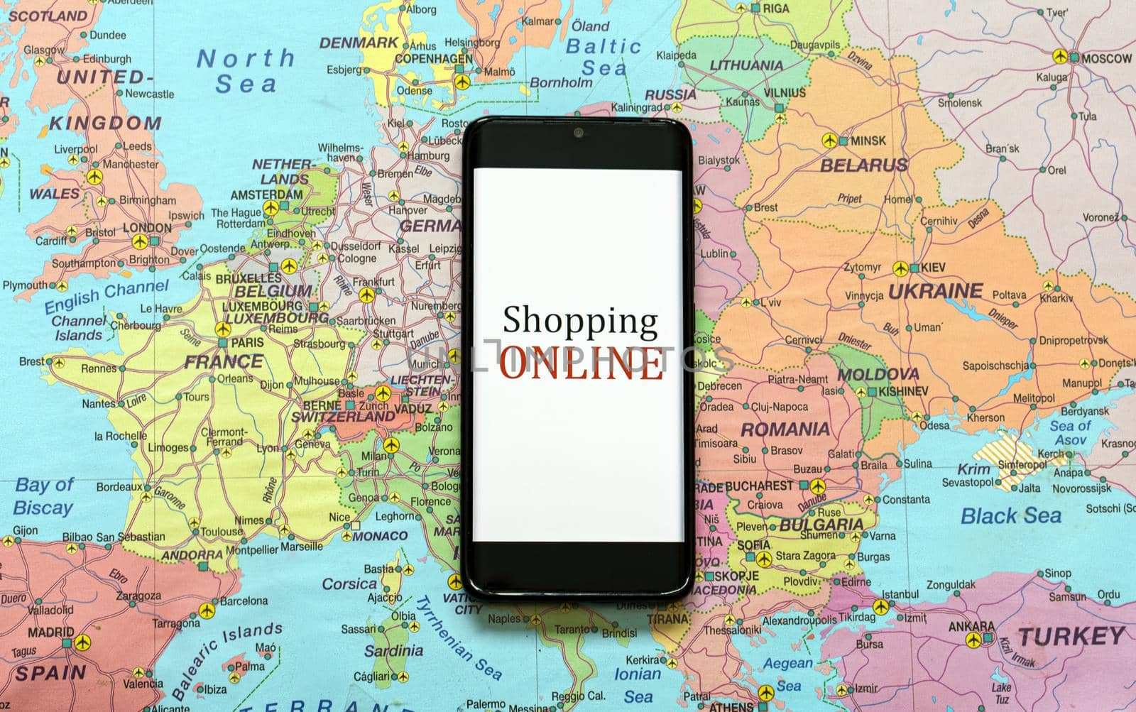 Mobile phone on Europe map. Online shopping concept. by dmitrimaruta
