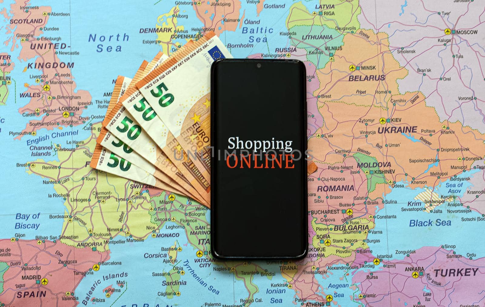 Mobile phone on Europe map. Online shopping concept.