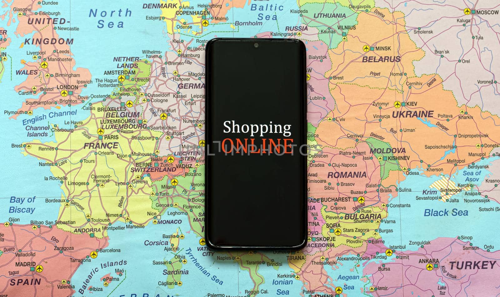 Mobile phone on Europe map. Online shopping concept. by dmitrimaruta