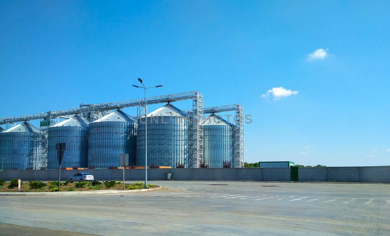 View of modern granaries for storing cereal grains outdoors by mtx