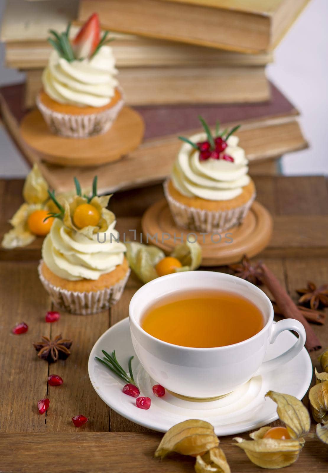 Autumn and winter baked pastries. Healthy muffins with traditional fall spices With tea cup. White marble table, copy space by aprilphoto