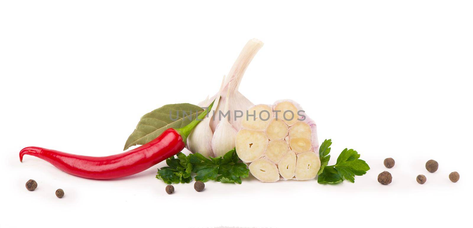 young garlic with cilantro and black peppercorns on a white background. Copy space.