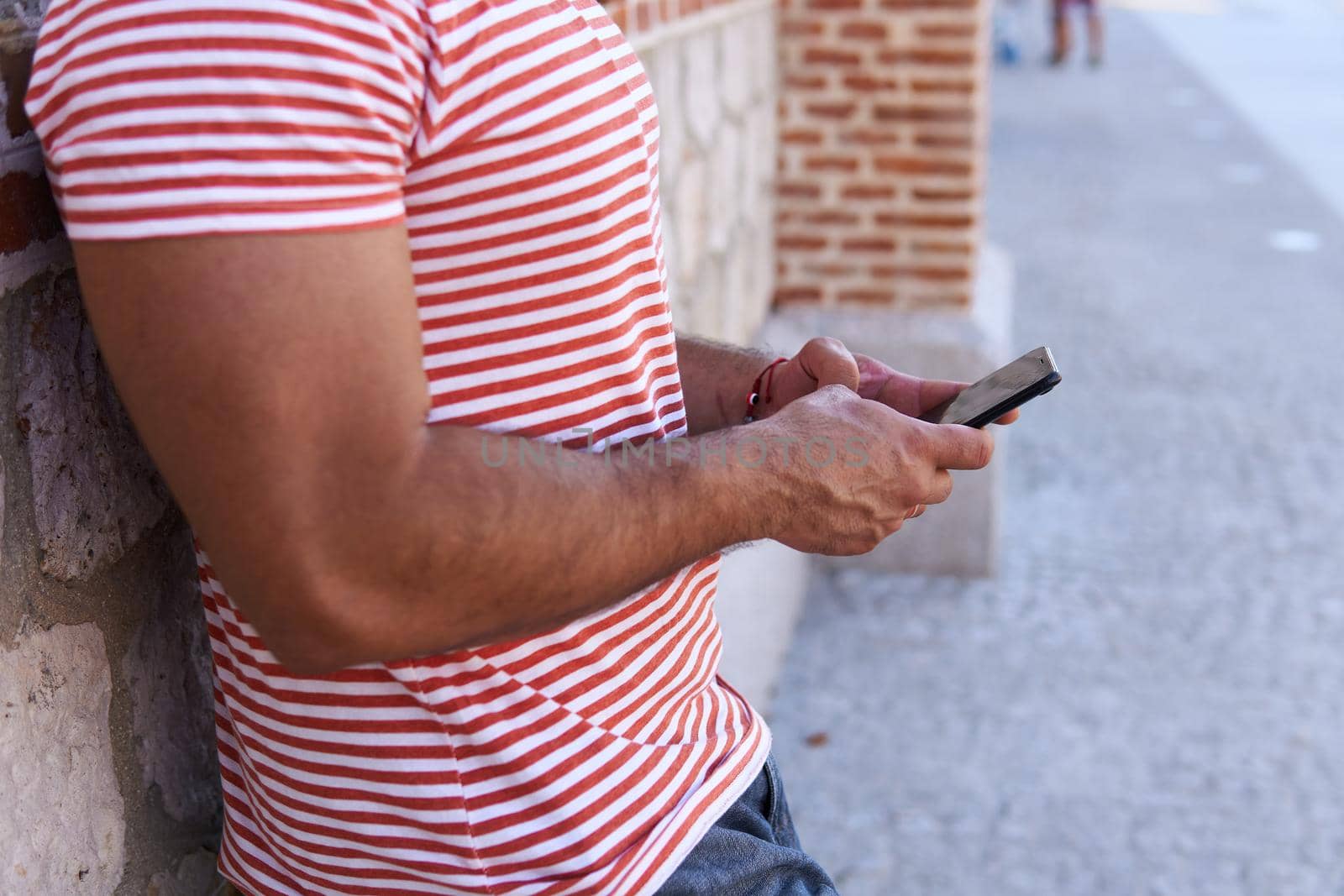 Man writing on the phone by xavier_photo