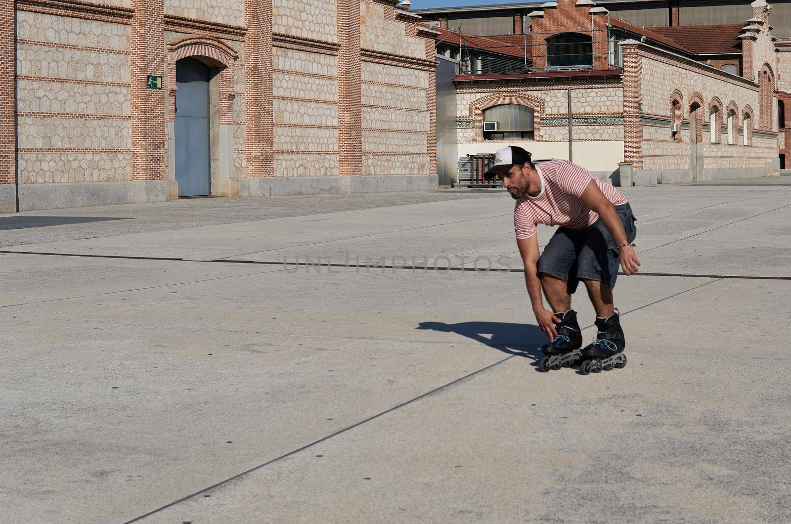 Man skating with a cap by xavier_photo